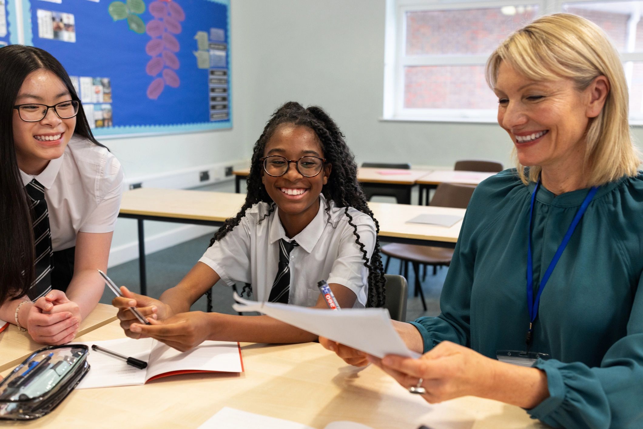 Teacher and students together in a supportive school setting